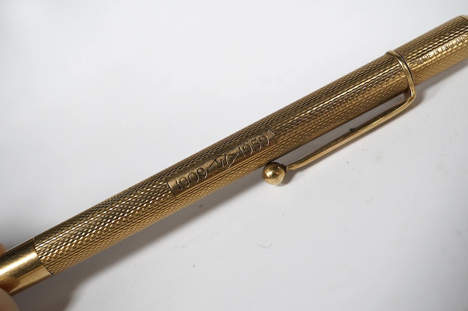 Two engine turned 9ct gold pencils, hallmarked for London, 1959 and London, 1969, both approx. 11.8cm. Condition - fair to good